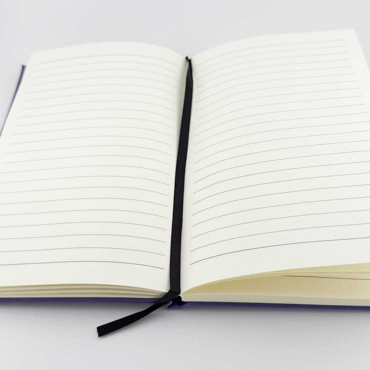 Lined pages inside the engraved journal