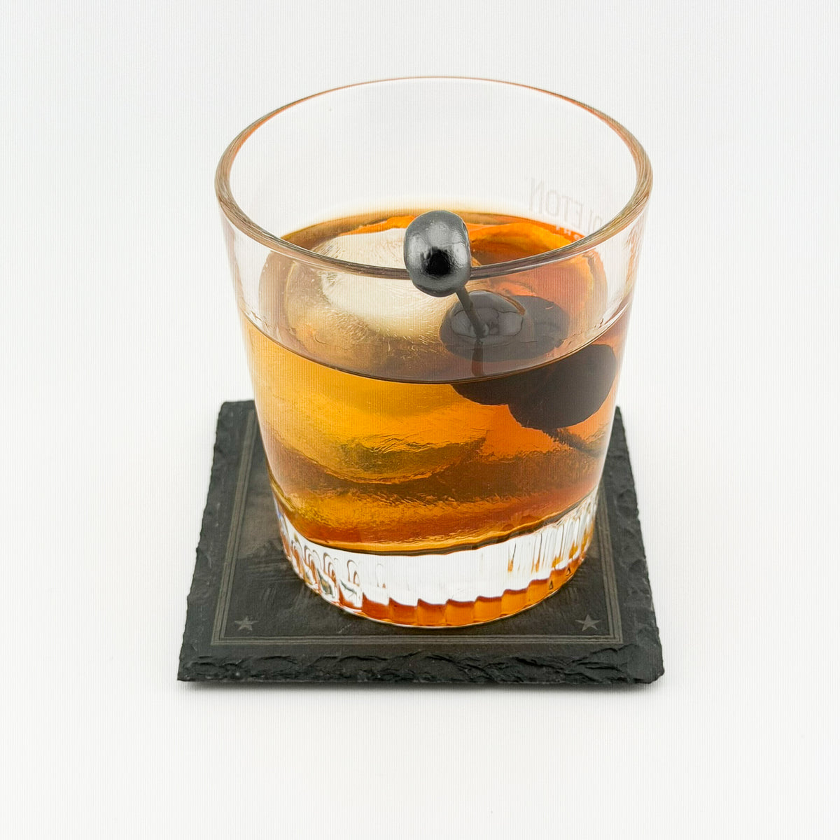 Engraved Slate Coaster - with a drink, in use