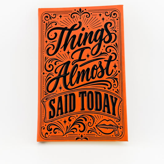 Things I Almost Said Today engraved orange journal, front cover