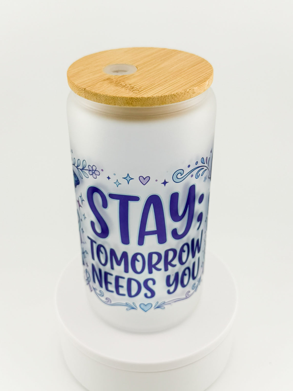 Stay; Tomorrow Needs You frosted glass can, angled view with bamboo lid