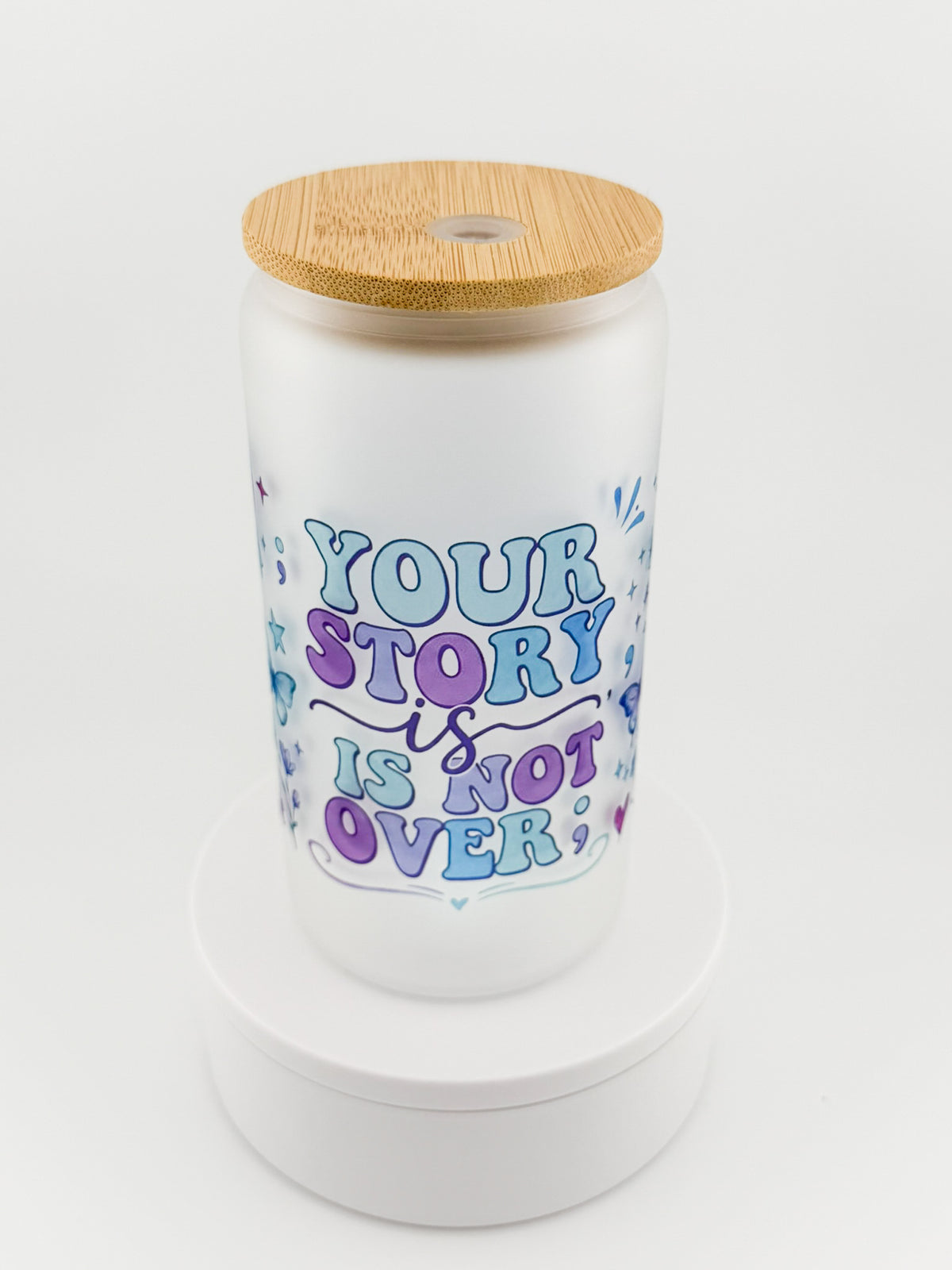 Your Story Is Not Over frosted glass can, angled view with bamboo lid