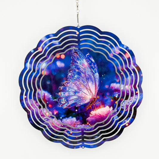Metal wind spinner with a glowing crystal butterfly on a pink flower in a blue and purple night garden
